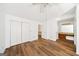 Bedroom featuring light wood floors, large closets and a makeup vanity area at 3652 Platina Park Ct, Decatur, GA 30034