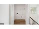 Open closet featuring shelving and hardwood style flooring at 3652 Platina Park Ct, Decatur, GA 30034