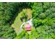 Stunning aerial view of a home nestled in lush greenery with a long driveway at 3258 South Mckoy Rd, Villa Rica, GA 30180