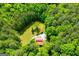 Beautiful aerial view of a secluded home site surrounded by mature trees and green lawn at 3258 South Mckoy Rd, Villa Rica, GA 30180
