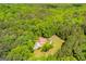 Overhead view of a residence surrounded by a green canopy and a winding driveway at 3258 South Mckoy Rd, Villa Rica, GA 30180