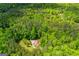 High-angle shot displaying home in the midst of a green, dense forest landscape at 3258 South Mckoy Rd, Villa Rica, GA 30180