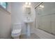 Clean bathroom with a shower, toilet and pedestal sink at 3258 South Mckoy Rd, Villa Rica, GA 30180