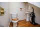 Bathroom with a pedestal sink, toilet, and wooden accessories at 3258 South Mckoy Rd, Villa Rica, GA 30180