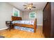 Bedroom with wood floors, a bed, and large windows at 3258 South Mckoy Rd, Villa Rica, GA 30180