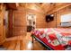 Bedroom showcasing wood paneled walls, a ceiling fan, and a view to another room at 3258 South Mckoy Rd, Villa Rica, GA 30180