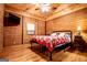 Bedroom with wood paneled walls and ceilings featuring a ceiling fan at 3258 South Mckoy Rd, Villa Rica, GA 30180