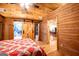 Bedroom featuring wood paneled walls and ceiling with view of the dining room at 3258 South Mckoy Rd, Villa Rica, GA 30180