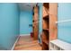 Bright walk-in closet with custom wood shelving and storage space at 3258 South Mckoy Rd, Villa Rica, GA 30180