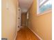 Hallway with hardwood floors and natural light streaming through the window at 3258 South Mckoy Rd, Villa Rica, GA 30180