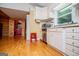 Functional kitchen features white cabinets, stainless steel appliances, and wood flooring at 3258 South Mckoy Rd, Villa Rica, GA 30180