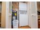 Convenient laundry area with a stackable washer and dryer unit, and storage cabinets at 3258 South Mckoy Rd, Villa Rica, GA 30180