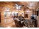 Spacious open-concept living room and kitchen featuring luxury vinyl plank floors and wood-paneled walls at 3258 South Mckoy Rd, Villa Rica, GA 30180
