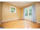 Sunlit living room with hardwood floors and natural light streaming through the windows at 3258 South Mckoy Rd, Villa Rica, GA 30180