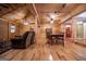 Inviting living room with an open floor plan, wood-paneled walls, ceiling fans, and hardwood floors at 3258 South Mckoy Rd, Villa Rica, GA 30180