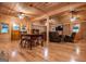 Spacious living room featuring wood walls, hardwood floors, ceiling fans, and comfortable seating at 3258 South Mckoy Rd, Villa Rica, GA 30180