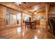 Spacious living room and kitchen featuring hardwood floors, wood-paneled walls, and modern fixtures at 3258 South Mckoy Rd, Villa Rica, GA 30180