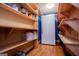 Well-organized pantry features wooden shelves, ample storage, and a freezer at 3258 South Mckoy Rd, Villa Rica, GA 30180