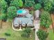 Captivating aerial shot of the home, pool, expansive yard, and detached garage at 124 Belford Way, Locust Grove, GA 30248