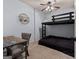 Cozy bedroom featuring a unique bunk bed design, with chair and workspace at 124 Belford Way, Locust Grove, GA 30248