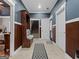 Welcoming entryway featuring coat rack, staircase and neutral color palette at 124 Belford Way, Locust Grove, GA 30248