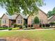 Well-maintained home with landscaped front yard and inviting curb appeal at 124 Belford Way, Locust Grove, GA 30248