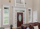 Elegant foyer with decorative glass on front door and plenty of natural light at 124 Belford Way, Locust Grove, GA 30248