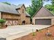 Spacious garages with ample parking space and well-maintained landscaping at 124 Belford Way, Locust Grove, GA 30248