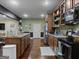 Kitchen with a large island, stainless steel appliances, and wood cabinets at 124 Belford Way, Locust Grove, GA 30248