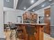 Breakfast bar area with seating and hardwood floors in an open floor plan at 124 Belford Way, Locust Grove, GA 30248