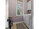 Functional laundry room with washer, dryer, and natural lighting at 124 Belford Way, Locust Grove, GA 30248