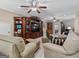 Inviting living room with cozy furniture, a built-in entertainment center, and stylish decor at 124 Belford Way, Locust Grove, GA 30248