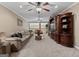 Expansive living room with neutral tones, plush sofas, and elegant built-in shelving at 124 Belford Way, Locust Grove, GA 30248