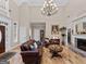 Bright living room with a fireplace, hardwood floors, and natural light at 124 Belford Way, Locust Grove, GA 30248