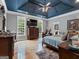 Spacious main bedroom boasting a dark ceiling, hardwood floors and windows at 124 Belford Way, Locust Grove, GA 30248