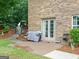 This patio features a stone walkway, covered grill, and access to the yard at 124 Belford Way, Locust Grove, GA 30248