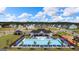 Wide angle aerial of community pool, clubhouse, playground, common areas, and surrounding neighborhood at 178 Aster, Locust Grove, GA 30248