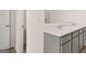 Bathroom features a double vanity with gray cabinets at 178 Aster, Locust Grove, GA 30248