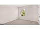 Bedroom features neutral carpet and a large window at 178 Aster, Locust Grove, GA 30248