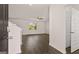 Inviting entryway featuring hardwood floors, a view into the living area, staircase, and a nearby closet at 178 Aster, Locust Grove, GA 30248