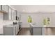 Modern kitchen with gray cabinets, granite countertops and stainless steel appliances at 178 Aster, Locust Grove, GA 30248