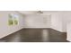 Open living area featuring hardwood floors and abundant natural light at 178 Aster, Locust Grove, GA 30248