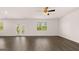 Spacious living room with ceiling fan, hardwood floors and ample natural light at 178 Aster, Locust Grove, GA 30248