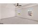 Large main bedroom with tray ceiling, ceiling fan, and lots of natural light at 178 Aster, Locust Grove, GA 30248