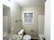 Bathroom featuring granite countertops, a large mirror, and a window for natural light at 438 Fedora Nw Way, Atlanta, GA 30331
