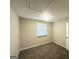 Neutral bedroom with plush carpet, a bright window, and ample space for relaxation at 438 Fedora Nw Way, Atlanta, GA 30331