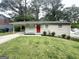 Inviting single-story home featuring a bright red front door and a convenient carport at 438 Fedora Nw Way, Atlanta, GA 30331