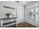 A foyer with hardwood floors, a white door, and an accent table at 92 Gordon Oaks Way, Moreland, GA 30259