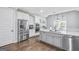 Spacious kitchen with stainless steel refrigerator, granite countertops, and ample cabinet space at 92 Gordon Oaks Way, Moreland, GA 30259