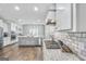Gourmet kitchen featuring granite countertops, stainless appliances, and subway tile backsplash at 92 Gordon Oaks Way, Moreland, GA 30259